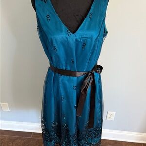 Elegant Teal Sleeveless Dress with Black Accents